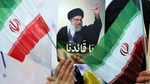 epaselect epa12682928 A Hezbollah supporter carries a portrait of the Iranian Supreme Leader Ayatollah Ali Khamene during a rally in solidarity with the Islamic Republic of Iran in the Dahieh suburb of Beirut, Lebanon, 26 January 2026. Thousands of supporters gathered to express solidarity with the Islamic Republic of Iran and condemn perceived 'insults and sabotage directed at Supreme Leader Ayatollah Ali Khamenei.  EPA/WAEL HAMZEH