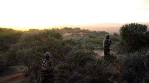 epa04434738 A handout photograph made available 06 October by the African Union-United Nations Information Support Team (AU-UN IST) shows soldiers from a joint Somali National Army and African Union Mission in Somalia (AMISOM) operation, patrolling a hill top above the al-Shabab held town of Barawae, Lower Shabelle region of Somalia, 05 October 2014. According to reports a joint military operation between AMISOM and the Somali Army met minimal resistance as they retook the strategically important port town of Barawe 05 October, 200km from the Somali capital Mogadishu, previously held by the Somali militant group al-Shabab since 2006 and used by them to bring in weapons and fighters from abroad, and support their cause through exports.  EPA/AMISOM PHOTO / TOBIN JONES / HANDOUT  HANDOUT EDITORIAL USE ONLY/NO SALES HANDOUT EDITORIAL USE ONLY/NO SALES