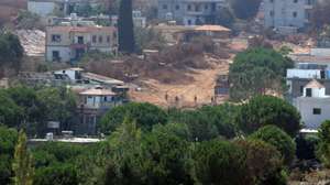 epa13166694 Israeli soldiers walk in the village of Zawtar al-Sharqiyah, as seen from Zawtar al-Gharbiya, southern Lebanon, 13 August 2026. Zawtar al-Gharbiya is among the designated pilot zones under the ceasefire agreement between Lebanon and Israel, from which Israeli forces have withdrawn.  EPA/WAEL HAMZEH