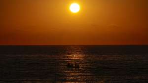 epa13078558 A boat sails during sunset on the coast of the Mediterranean Sea, in Beirut, Lebanon, 01 July 2026.  EPA/WAEL HAMZEH