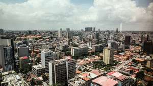 epa08319382 Aerial view of Luanda, Angola, 24 March 2020. The Angolan capital on 24 March saw the first day of restrictive measures meant to curb the spread of the ongoing pandemic of the COVID-19 disease caused by the SARS-CoV-2 coronavirus, which includes at least two weeks of suspension of school, sports and cultural events, religious services and various public activities. However, many residents were failing to comply with the authorities&#039; recommendations on social distancing and self-isolation by refusing to stay inside their homes.  EPA/AMPE ROGERIO