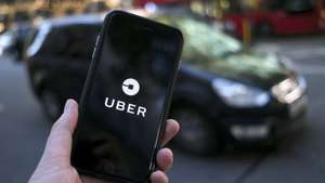 epa09023553  (FILE) - An Uber logo on a mobile telephone in central London, Britain, 22 September 2017 (re-issued 19 February 2021). The UK Supreme Court on 19 February 2021 ruled the Uber drivers are not not self-employed but workers. Uber, that has some 45,000 drivers working in London and that lost earlier court cases, said it would contact its active drivers across UK and discuss the operations. The ruling could mean Uber drivers may be entitled to holiday payments and minimum wages.  EPA/WILL OLIVER *** Local Caption *** 55660504