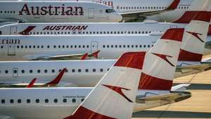 epa08406732 General view of Austrian Airlines (AUA) planes grounded at the Vienna International Airport (VIC) in Schwechat, Austria, 07 May 2020. According to media reports, AUA, part of the Lufthansa Group and headquartered in Vienna, Austria, is planning to cut 1,100 of the 7,000 jobs by 2023 and that wages are to fall by 13 per cent. The company temporarily suspended all regular flight operations due to the SARS-CoV-2 coronavirus, which causes the COVID-19 disease.  EPA/CHRISTIAN BRUNA
