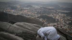 epaselect epa06169111 A Muslim worshipper prays on the top of Mount Al-Noor where the Prophet Muhammad received the first words of the Koran in Mecca, Saudi Arabia, 28 August 2017. Around 2.6 million muslims are expected to attend this year's Hajj pilgrimage, which is highlighted by the Day of Arafah, one day prior to Eid al-Adha. Eid al-Adha is the holiest of the two Muslims holidays celebrated each year, it marks the yearly Muslim pilgrimage (Hajj) to visit Mecca, the holiest place in Islam. Muslims slaughter a sacrificial animal and split the meat into three parts, one for the family, one for friends and relatives, and one for the poor and needy.  EPA/MAST IRHAM