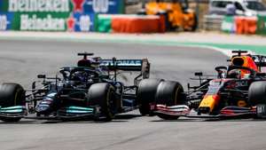 epa09174306 British Formula One driver Lewis Hamilton (L) of Mercedes-AMG Petronas is on his way to win the 2021 Formula One Grand Prix of Portugal at the Autodromo Internacional do Algarve near Portimao, Portugal, 02 May 2021. Hamilton won ahead of second placed Dutch driver Max Verstappen (R) of Red Bull Racing.  EPA/JOSE SENA GOULAO