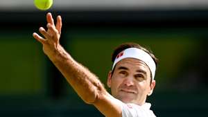 epa09329194 Roger Federer of Switzerland serves during the men's quarter final match against Hubert Hurkacz of Poland at the Wimbledon Championships, in Wimbledon, Britain, 07 July 2021.  EPA/NEIL HALL   EDITORIAL USE ONLY