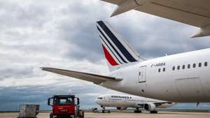 epa09130182 A truck carrying refrigerated containers of Chinese vaccine SinoVac  wait for the loading in an Air France Boeing 787 bound for Bogota, Colombia, at Roissy Airport, near Paris, 11 April 2021 (issued 12 April 2021). Airline company Air France KLM Cargo, operated two flies to Cameroon and Colombia with a shipment of Chinese covid19 vaccines SinoPharm and SinoVac through its cargo area of Roissy airport (CDG).  EPA/CHRISTOPHE PETIT TESSON