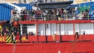 epa09569971 The Sea Eye 4 ship carrying some 850 migrants rescued in various rescue operations carried out in the last few days in the Mediterranean sea, docks in the port of Trapani, Sicily island, southern Italy, 07 November 2021.  EPA/CARMELO IMBESI