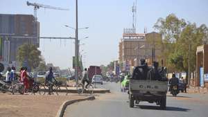 epa09706526 Police patrols quiet streets in Ouagadougou, Burkina Faso, 24 January 2022. Soldiers mutinied at several barracks overnight on 23 January. Civilian life continued as normal on 24 January after demonstrators clashed with police in support of the military on the previous day.  EPA/STR