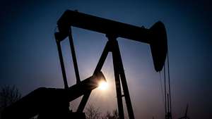 epa09842940 A pump jack of the German Wintershall Dea company conveys crude oil on an oil field near the German-Durch border in Emlichheim, Germany, 22 March 2022. The Russian invasion of Ukraine has led many governments besides Germany aiming at becoming less dependent on Russian oil and gas imports.  EPA/SASCHA STEINBACH