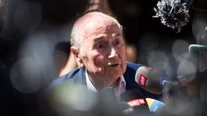 epaselect epa10058873 The former FIFA President, Joseph Blatter (C) surrounded by media representatives, speaks to the press in front of the Swiss Federal Criminal Court after the verdict has been announced, in Bellinzona, Switzerland, 08 July 2022. The trial ended with an acquittal. Former FIFA President Joseph Blatter and former UEFA president Michel Platini, stood trial before the Federal Criminal Court over a suspicious two-million payment. The Federal Prosecutor's Office accused them of fraud. The defense spoke of a conspiracy.  EPA/ALESSANDRO CRINARI