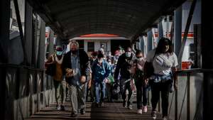 People coming from Lisbon arrive at Cacilhas station, Almada, Portugal, 20 May 2020. Public transportation has been strengthened with the entry of the second phase of deconfinement due to the covid-19 pandemic, despite this, careers are still short, which contrasts with the large use of river transport by Transtejo/Soflusa. MARIO CRUZ/LUSA