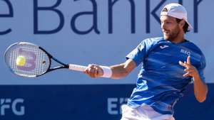 epa10078025 Joao Sousa of Portugal in action against Alexander Ritschard of Switzerland at the Swiss Open tennis tournament in Gstaad, Switzerland, 18 July 2022.  EPA/PETER SCHNEIDER