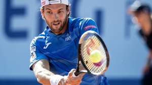 epa10078021 Joao Sousa of Portugal in action against Alexander Ritschard of Switzerland at the Swiss Open tennis tournament in Gstaad, Switzerland, 18 July 2022.  EPA/PETER SCHNEIDER
