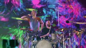 epaselect epa09859914 The vocalist of the British rock-pop band Coldplay Chris Martin and drummer Will Champion perform, as part of his 'Music of the Spheres' world tour, at the Akron Stadium in Zapopan, Jalisco state, Mexico, 29 March 2022.  EPA/Francisco Guasco