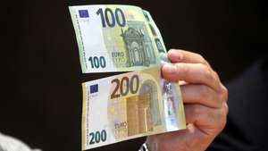 epa07596699 A view of new euro banknotes in Riga, Latvia, 24 May 2019. Latvia will be launching new 100 euro and 200 euro banknotes On 28th May 2019. These are the latest European series of banknotes with refurbished design and advanced security features.  EPA/Toms Kalnins