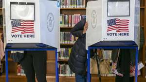 epa10294379 People vote at a polling site in the Central Brooklyn Public Library in the Brooklyn borough of New York, New York, USA, 08 November 2022. The US midterm elections are held every four years at the midpoint of each presidential term and this year include elections for all 435 seats in the House of Representatives, 35 of the 100 seats in the Senate and 36 of the 50 state governors as well as numerous other local seats and ballot issues.  EPA/SARAH YENESEL