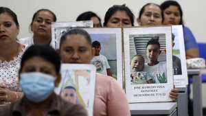 epa10514195 Relatives of people detained under the emergency regime show their photographs during a press conference, in San Salvador, El Salvador, 10 March 2023. The relatives of 66 people detained in the remote area of Bajo Lempa, in eastern El Salvador, denounced the Salvadoran State before the Inter-American Commission on Human Rights (IACHR) on 07 March for the 'systematic violation' of their rights.  EPA/Rodrigo Sura
