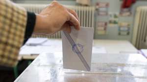 epa10642751 A woman casts her vote during the general elections at a polling station in Athens, Greece, 21 May 2023. Greek voters will go to the polls on 21 May 2023 to cast their ballots in the Greek general elections.  EPA/ACHILEAS CHIRAS