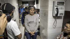 epa10825940 Guatemalan lawyer Claudia Gonzalez (C) stands at the Courts Tower after being detained by the Guatemalan Public Ministry (Prosecutor's Office), in Guatemala City, Guatemala, 28 August 2023. The Guatemalan Prosecutor's Office arrested on 28 August lawyer Claudia Gonzalez, a former official of the International Commission Against Impunity in Guatemala (CICIG), and a defender of the exiled former anti-corruption prosecutor Juan Francisco Sandoval. According to the Prosecutor's Office, Gonzalez is accused of alleged 'abuse of authority'.  EPA/ESTEBAN BIBA