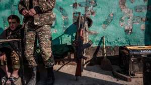 epa10893783 (FILE) - Armenian soldiers wait at a military control point in Martakert, a north-eastern city of the self-proclaimed Nagorno-Karabakh Republic, 17 January 2021. (Issued 01 October 2023). The self-declared Republic of Nagorno-Karabakh, is a territory mostly home to ethnic Armenians that the Soviets allocated to Azerbaijan in 1921 and is recognized as Azerbaijani by the international community.  Some 120,000 ethnic Armenians of the enclave have, in September 2023, joined again the roads to exodus. Caught in the conflict  with Azerbaijan,  and after dozens of violence flares since the 1990's, they have repeatedly had to leave their lands and become displaced or refugees in the tens of thousands, losing over the years their homes and thousands of loved ones to direct fighting or to collateral damage.  After a ceasefire was agreed on, on 20 September 2023, Azerbaijan opened all the checkpoints with Armenia for the unimpeded exit of civilians from the disputed territory. The Armenian government announced the evacuation of more than 96,000 local residents from Nagorno-Karabakh, and a humanitarian center has been set up near the main route between Armenia and the breakaway region. Nagorno-Karabakh will cease to exist as a self-proclaimed state from 01 January 2024, the region's separatist leader, Samvel Shakhramanyan, announced on 28 September, after signing a decree to dissolve all its institutions.  EPA/CHRISTOPHE PETIT TESSON ATTENTION: For the full PHOTO ESSAY text please see Advisory Notice epa09033329 and epa09033330 ATTENTION: This Image is part of a PHOTO SET *** Local Caption *** 56719908