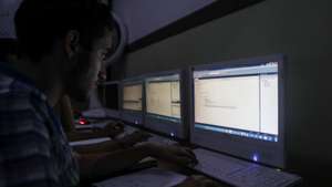 epa06178321 Students enter code on the computer in a computer programming class, in Douma,  Syria, 20 August 2017 (issued 01 September 2017). The summer camp for teenagers is organized by Sapili Station for Technology and Science and is the first of its kind in Eastern al-Ghouta.  The station provides academic training programs, higher education programs, applied science and specific training programs in various fields of technology and science.  EPA/Mohammed Badra