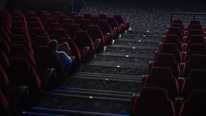 epa08289915 A sole spectator watches a film at a movie theatre in Budapest, Hungary, 12 March 2020. Effective of 12 March, cinemas are restricted to sell a maximum of 99 tickets for a show as on the previous day the Hungarian government declared a state of emergency in response to the novel coronavirus, and prohibited all indoor events with more than 100 participants and outdoor events attended by more than 500 participants. Three more cases have emerged in Hungary on 12 March 2020, bringing the number of confirmed cases of Covid-19 in the country to 16, including nine Iranian, six Hungarian and one British citizens.  EPA/Marton Monus HUNGARY OUT