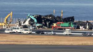 epa11058376 Workers start to remove wreckage following the crash of a Japan Airlines passenger plane with a Japan Coast Guard plane at Haneda Airport in Tokyo, Japan, 05 January 2024. The passenger plane carrying 367 passengers and 12 crew crashed with a Japan Coast Guard plane for transporting relief supplies for the earthquake hit areas. All passengers and crew on board the passenger plane evacuated safely. Tokyo Metropolitan Police confirmed five of six crew on board the Japan Coast Guard plane were dead. Japan Airlines announced on 03 January that the JAL aircraft recognized the controller's permission to land, read it back, and performed the landing operation. It appears that the Japan Coast Guard plane was already on the runway when it attempted to land, and the Japan Transport Safety Board and the Metropolitan Police Department are investigating the interaction between the controller and the two planes in detail to determine the cause of the accident.  EPA/JIJI PRESS JAPAN OUT EDITORIAL USE ONLY