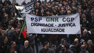 Police officers hold a banner with the words "Dignity, Justice, Equality" protest during a demonstration by the platform of PSP (Public Security Police) unions and GNR (National Republican Guard) associations for the restructuring of pay supplements and for the enhancement and dignification of professionals, Porto, Portugal, 31 January 2024.  ESTELA SILVA/LUSA