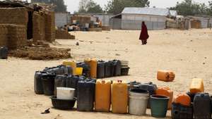 epa09084514 Empty plastic containers are arranged in line to fetch water at a bore-point seen at an internal displaced people's camp in Maiduguri, northeast Nigeria, 19 March 2021. Boko Haram crisis, which has lasted more than 10 years in Nigeria's northeast, has targeted more women and children for abduction, forced conversion to Islam, physical and psychological abuses, forced labour and marriage. Although Boko Haram's violence against women and children has been at the center of global attention since its inception, delivery of protection and supports for domestic needs for the IDPs have been huge challenges that many institutional support groups are facing.  EPA/AKINTUNDE AKINLEYE