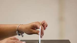 epa11399620 A citizen casts her ballot for the European Elections at a polling station in Lisbon, Portugal, 09 June 2024. More than 10.8 million registered voters in Portugal and abroad go to the polls on 09 June to choose 21 of the European Parliament&#039;s 720 members.  EPA/ANDRE KOSTERS