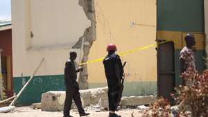 epa10055819 Destruction at the gate of Kuje Medium Prison in Abuja, Nigeria, 06 July 2022. Boko Haram gunmen are suspected of attacking the Kuje Medium Prison. Some 400 inmates are missing.  EPA/STRINGER