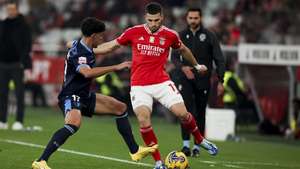 epa11048713 Benfica player David Jurasek (R) in action against Famalicao player Afonso Rodrigues during the Portugal First League Soccer round 15 match Benfica vs Famalicao held at Luz Stadium, Lisbon, Portugal, 29 December 2023.  EPA/JOSE SENA GOULAO