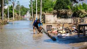 epaselect epa11513135 A villager cleans a chair at Huazhong Village of Hekou Town, Xiangtan County, central China&#039;s Hunan Province, July 31, 2024. Heavy rainfall has affected 1.15 million people in central China&#039;s Hunan Province since Friday, leading to direct economic losses of around 6.13 billion yuan (about 859.75 million U.S. dollars), local authorities said Wednesday. Heavy rainstorms from Typhoon Gaemi forced the evacuation of 95,000 people in the province, with 49,800 requiring emergency relief, according to preliminary statistics from the provincial flood control and drought relief headquarters.  EPA/XINHUA / Chen Sihan CHINA OUT / UK AND IRELAND OUT  /       MANDATORY CREDIT EDITORIAL USE ONLY