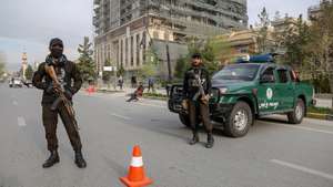 epa11269120 Taliban security stand guard on a road as people preare for Eid al-Fitr prayer, in Kabul, Afghanistan, 10 April 2024. Muslims worldwide celebrate Eid al-Fitr, a two or three-day festival, at the end of the Muslim holy fasting month of Ramadan. It is one of the two major holidays in Islam. During Eid al-Fitr, most people travel to visit each other in town or outside of it and children receive new clothes and money to spend for the occasion.  EPA/SAMIULLAH POPAL