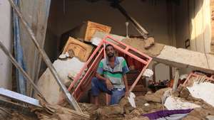 epa11569349 A man inspects damaged houses in a flood-affected area, in Masawi, the northern state of Merowe, Sudan, 28 August 2024. At least 132 people have died in Sudan due to flooding and heavy rains, according to a Sudan&#039;s Health Ministry statement on 26 August 2024. A total of 31,666 families and 129,650 individuals were affected by the flooding in ten states, the statement reads. Over 12,400 homes have completely collapsed and 11,472 partially damaged mainly in the Sudanese Northern and River Nile states.  EPA/STR