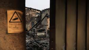 Oficina de automóveis destruída pelos incêndios que atingiram Gondomar, 18 de setembro de 2024. Sete pessoas morreram e 40 ficaram feridas, duas com gravidade, nos incêndios que atingem desde domingo as regiões Norte e Centro do país, nos distritos de Aveiro, Porto, Vila Real e Viseu, e que destruíram dezenas de casas e obrigaram a cortar estradas e autoestradas, como a A1, A25 e A13. JOSÉ COELHO/LUSA