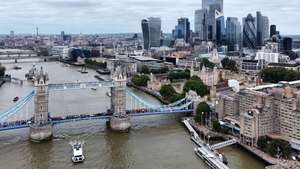 epa11550143 A picture taken with a drone shows the Tower Bridge and skyline of the financial district of the City of London in London, Britain, 15 August 2024.  According to the Office for National Statistics (ONS), Britain's economy grew by 0.6 percent between April and June 2024, slowing down compared to the first quarter. Services were the biggest contributor to the country's economy, outstripping both manufacturing and construction.  EPA/NEIL HALL