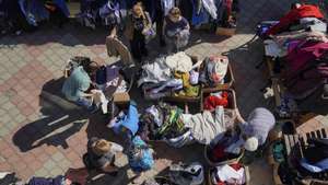 epa11591673 Civilians who were evacuated from the Kursk region border with Ukraine, receive humanitarian aid at the Uspensko-Nikitsky Cathedral in Kursk, Russia, 07 September 2024. Fighting with the Ukrainian Armed Forces has been ongoing in the Kursk Region since 06 August, with around 180,000 people being evacuated by mid-August.  EPA/STRINGER