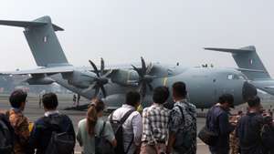 epa11493642 A group of journalists stands near a French Airbus A400M Atlas aircraft at Halim Perdanakusuma Air Force Base in Jakarta, Indonesia, 24 July 2024. A number of French military aircraft visited Jakarta after completing a long-range force projection mission across the Indo-Pacific as part of the Pegase 2024 mission. The visit aims to strengthen defense cooperation between Indonesia and France, who have officially agreed on a contract to buy six of the 42 Rafale fighter jets made by Dassault Aviation.  EPA/ADI WEDA