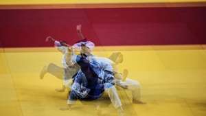 epaselect epa09142797 A multiple exposure picture of Nemanja Madjov of Serbia (white) ippon win against Martin Matijass of Germany  (blue) during the second round in the men&#039;s -90kg category at the European Judo Championships in Lisbon, Portugal, 18 April 2021.  EPA/NUNO VEIGA