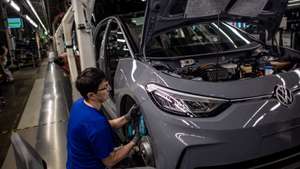 epa10650234 A Volkswagen employee works on the assembly of an ID.3 automobile on the electric cars production line at the Volkswagen (VW) vehicle factory in Zwickau, Germany, 24 May 2023. The plant in Zwickau, completely re-equipped for electric mobility for a total of 1.2 billion euros, produces exclusively all-electric vehicles and has become the largest and highest-performance electric car plant in Europe for the Volkswagen group.  EPA/MARTIN DIVISEK
