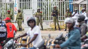 epa11620830 Members of the security forces stand guard after preventing a banned opposition rally from taking place in Dar es Salaam, Tanzania, 23 September 2024. Tanzanian police arrested supporters of the main opposition party Chadema for participating in a banned protest to demand an end to alleged political abductions and killings. According to police, 14 people were arrested, including Chadema party chairman Freeman Mbowe and vice-chairman Tundu Lissu, for defying a prohibition on the protests. Leaders of the opposition have accused Tanzanian President Samia Suluhu Hassan of cracking down on democracy ahead of elections in November 2024 and in 2025.  EPA/ANTHONY SIAME