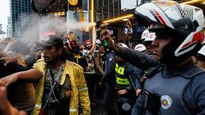 epa11606888 Police and protesters clash over agrarian reform and against the fires affecting the entire country in Sao Paulo, Brazil, 15 September 2024. For over a month, nearly 60 percent of the countryâ€™s territory has been experiencing severe drought, with temperatures much higher than usual, leading to thousands of fire outbreaks across all regions, particularly impacting areas of the Amazon, the Central Cerrado savanna, and the Pantanal.  EPA/ISAAC FONTANA