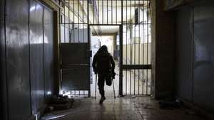 epa11773140 A man visits the Sednaya prison, dubbed by Amnesty International as the 'Human Slaughterhouse', near Damascus, Syria, 12 December 2024. Syrian rebels entered Damascus on 08 December 2024 and announced in a televised statement the 'Liberation of the city of Damascus and the overthrow of Bashar al-Assad', as well as the release of all the prisoners.  EPA/ANTONIO PEDRO SANTOS