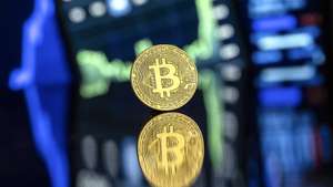 epaselect epa11734557 An illustration shows a symbolic Bitcoin, in Lugano, Switzerland, 22 November 2024. The world's most popular cryptocurrency hit a record high on 21 November, approaching the 100,000 US dollar (USD) mark. Bitcoin has been regularly hitting fresh records this month on hopes that US President-elect Donald Trump will usher in a golden age of cryptocurrencies.  EPA/PABLO GIANINAZZI