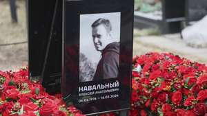 epaselect epa11892214 Floral tributes and a portrait are seen at the grave of late Russian opposition leader Alexei Navalny at the Borisovskoye cemetery, in Moscow, Russia, 13 February 2025. Navalny died aged 47 in an arctic penal colony on 16 February 2024, after being transferred there in 2023. The colony is considered to be one of the world's harshest prisons. Alexei Navalny's body was laid to rest on 01 March 2024 at the Borisovskoye cemetery in Moscow.  EPA/MAXIM SHIPENKOV