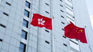 epa11016657 The Hong Kong SAR flag (L) and the People's Republic of China flag (R) are displaced outside the High Court in Hong Kong, China, 08 December 2023. The judge denied the Department of Justice's request to appeal the Court of Appeal's decision on the anti-government protest on 18 August 2019 at the Court of Final Appeal. However, permission to appeal was granted to the applicants, including Jimmy Lai Chee-Ying, the founder of the now-defunct Apple Daily, barrister Margaret Ng and Martin Lee Chu-ming, the founder of the Democratic Party.  EPA/BERTHA WANG
