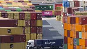 epa12022791 Shipping containers are stacked at the Duisport in Duisburg, Germany, 10 April 2025. US President Trump on 09 April has paused for 90 days the implementation of higher tariffs announced on 02 April for most countries, except China whose tariff has increased to 125 percent.  EPA/CHRISTOPHER NEUNDORF