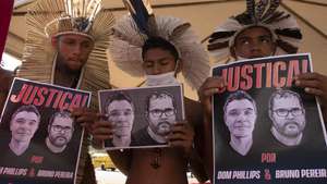 epa10030251 Several people hold posters with portraits of British journalist Dom Phillips and Brazilian indigenista Bruno Araujo, during a demonstration called throughout the country by officials of the National Indian Foundation (Funai) to ask for Justice for their murders, in Brasilia, Brazil, 23 June 2022. Phillips and Araujo had been missing since 05 June and had been seen for the last time when they were sailing down a river in the Valle do Jaravi region, in a remote area of the Brazilian Amazon bordering Colombia and Peru. The Federal Police confirmed on 18 June their deaths from gunshot wounds, corroborating the crime, which shocked Brazil and has sparked protests around the world.  EPA/Joedson Alves